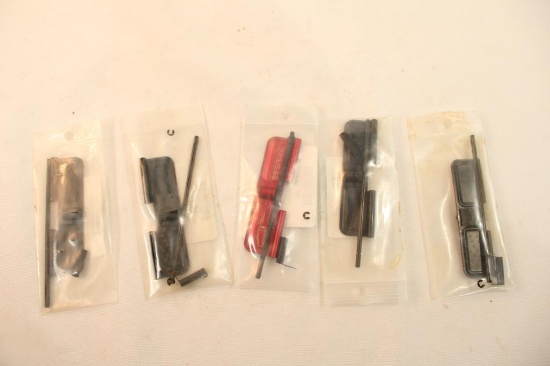 Five AR-15 dust covers. In packages.