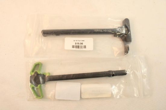 Two Ar charging handles. In packages.