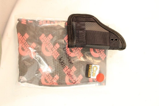 One magnetic Force outside the waistband holster. In package.
