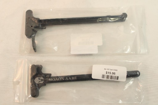 Two AR-15 charging handles.