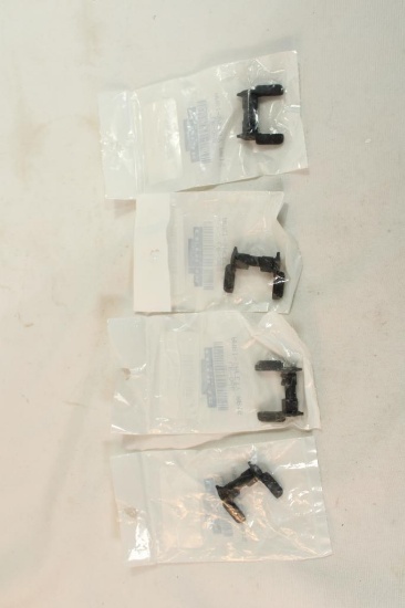 Four ambidextrous AR selector safeties. In packages.