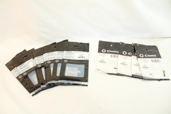 Three CMMG MK3 firing pin retainers, and nine Sig Sauer tapered firing pin blocks. In packages.