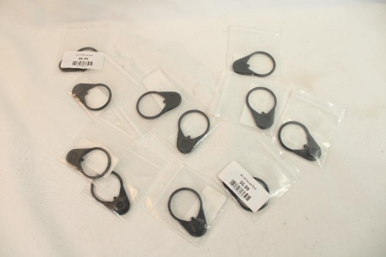 Eleven AR 15 receiver stock latch plates. In packages.