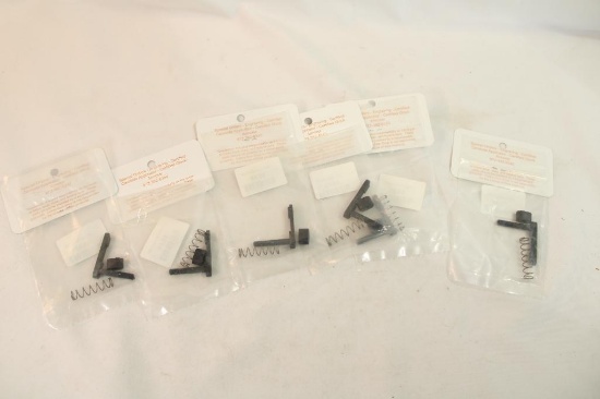 Six AR magazine releases. In packages.