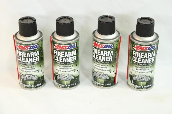 Three cans of AMSoil firearms cleaner.