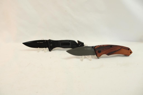 Two Tac-Force belt clip folding lockback knives. In packages.