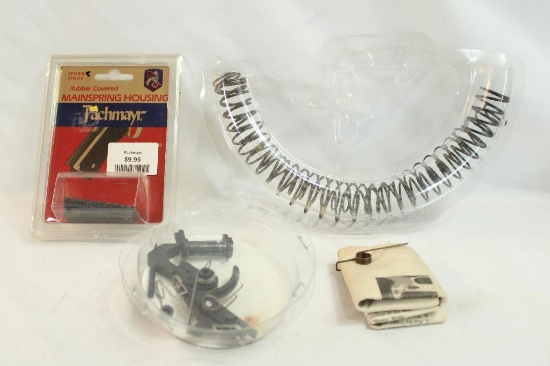 One AR trigger and two buffer springs.