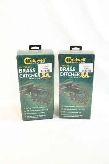 Two Caldwell universal brass catchers. In boxes.