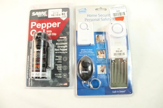 One Sabre door alarm and one one Sabre pepper gel spray. In packages.