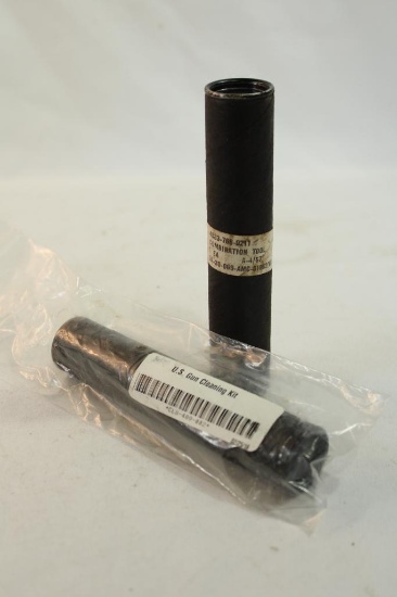 Two U.S. gun cleaning kits.