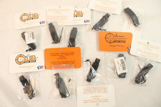 Ten black polymer trigger guards, new in pkgs