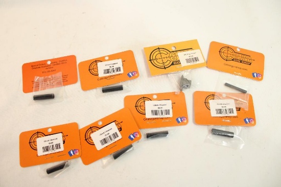 Six Glock channel liners and one AK grip T-nut, new in pkgs