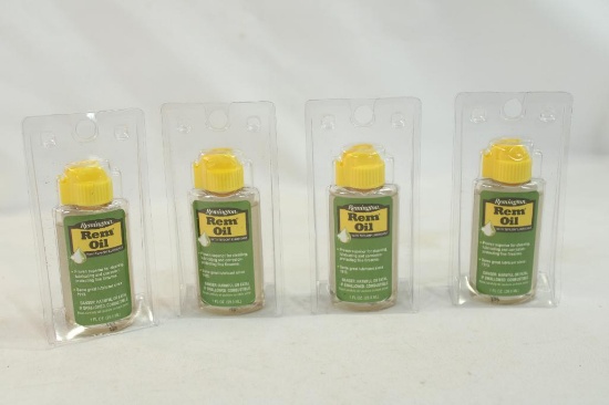 Four 1 oz bottles of Remington Rem Oil, new