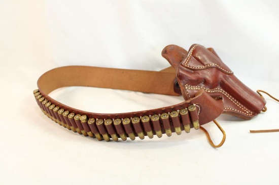 One leather ammo belt with holster and 25 rounds of Federal .357 mag ammo