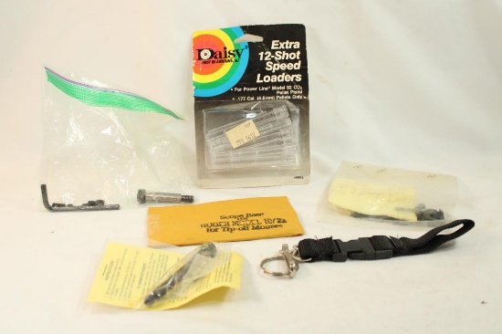 Bag containing Daisy 12 spot speed loaders, M1 Garand screws/parts, scope base for Ruger 10/22 and