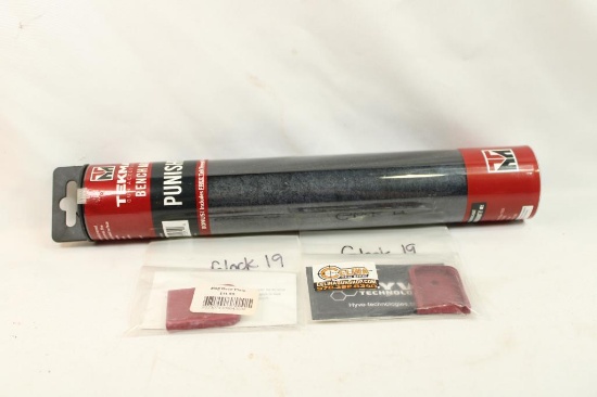 Two Glock 19 mag base plates and a Punisher Tekmat bench mat, new in pkgs