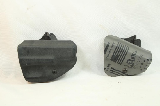 Two right hand carry molded plastic holsters