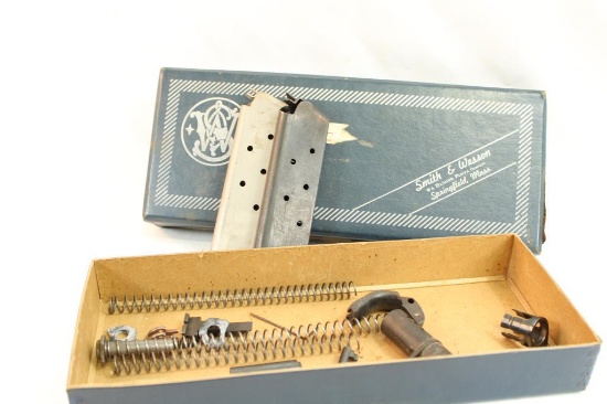 Smith & Wesson pistol box containing two Colt .45 Auto magazines, 3 recoil springs and other misc