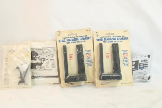 Two 10 round .223/5.56 magazine chargers, two Tri Burst AR-15 trigger activators and one Ashco TAC