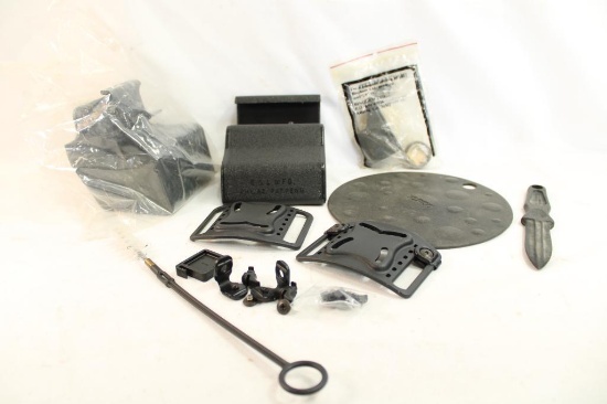 Two Blackhawk CQC holster belt loop platforms, two E&L Manufacturing molded plastic brass catchers