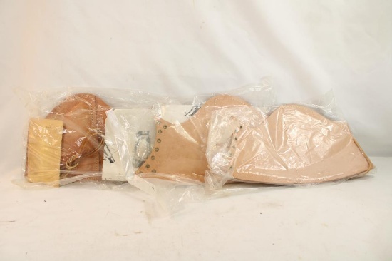 Three leather rifle cheek pads, new in pkg
