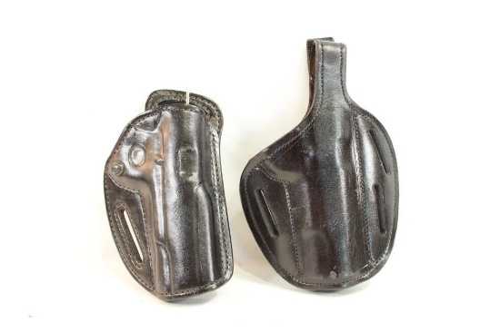 Two black leather holsters for .45 govt