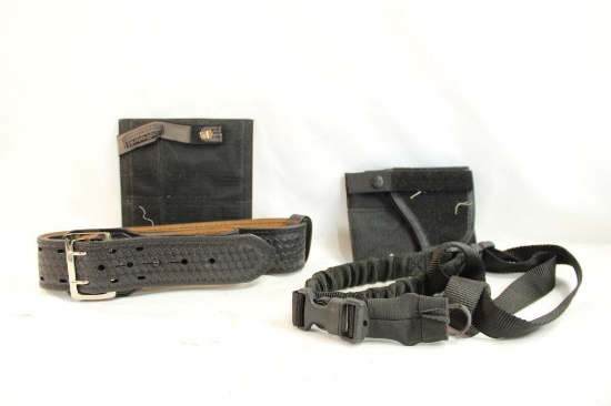 Black leather belt, two velcro Under Tech holsters and one single point gun sling