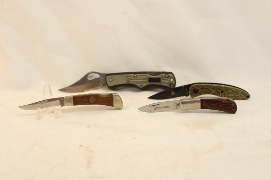 Bag containing four folding pocket knives, one Magnum 2" lock blade, one Chicago Cutlery 2" lock