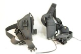 Two black nylon holsters with straps