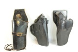 Three black leather holsters