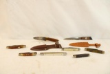 Six small folding pocket knives and 2 small fixed blade knives with leather sheaths