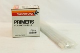 One box of Winchester W209 shotgun primers, count 1000, and 4 primer loading tubes.
