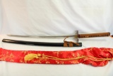 One double pin handle release Samurai sword in silk bag.