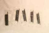 Five AR-15 dust covers. In packages.