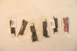 Five AR-15 dust covers. In packages.