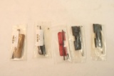 Five AR-15 dust covers. In packages.