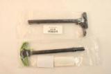 Two Ar charging handles. In packages.