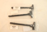 Three AR charging handles. In packages.