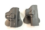 Two right handed paddle holsters.