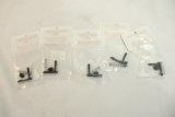 Five AR-15 magazine releases. In packages.