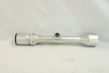 One silver Bushnell 3-9x40 duplex rifle scope with scope covers.