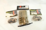 One BlackHawk green nylon belt shotshell carrier, and two Amacker derm-o-flage gun socks. In