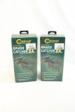 Two Caldwell universal brass catchers. In boxes.
