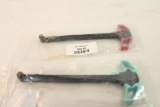 Two AR-15 charging handles.