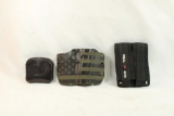 Molded plastic holster, one nylon dual mag carrier and one leather dual mag holder for .45 govt