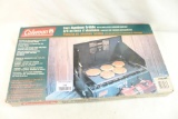 Coleman two burner propane stove with leather carry case, two bottles and cast aluminum griddle