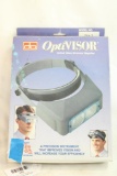 One Optivisor magnifying binoculars