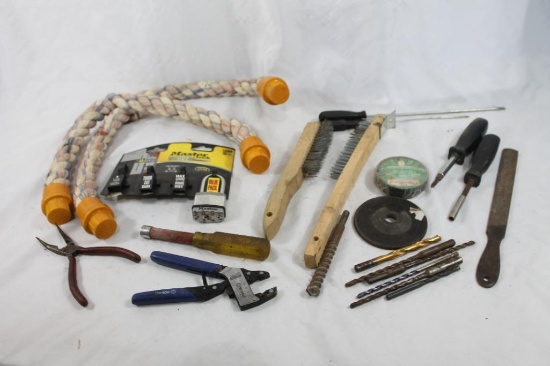 Box containing large dog toy, wire brushes, drill bits and other mic tools