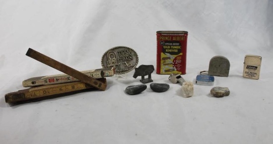 Bag containing misc items including two folding wooden tape measures, a Coleman refillable lighter,