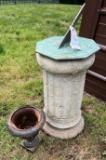 Brass sundial on cement stand